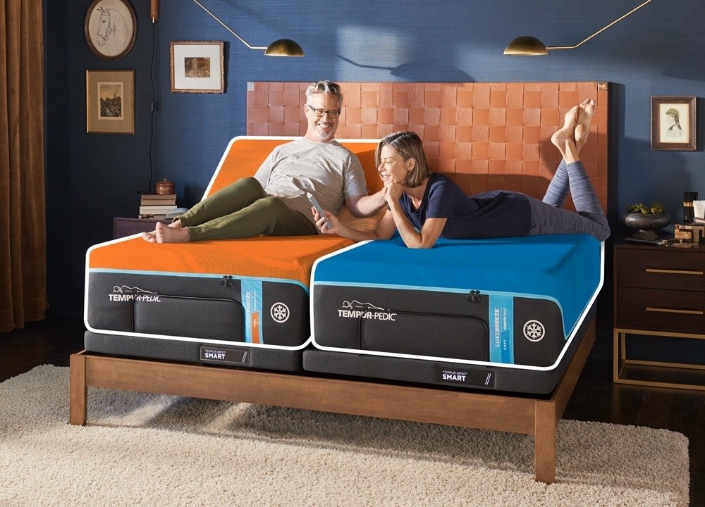 A couple laying on a Split king mattress in a firm and soft feel - mobile view