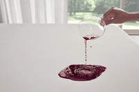 showing wine spill on mattress protector