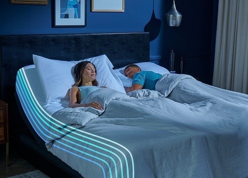 Couple sleeping on a Breeze mattress